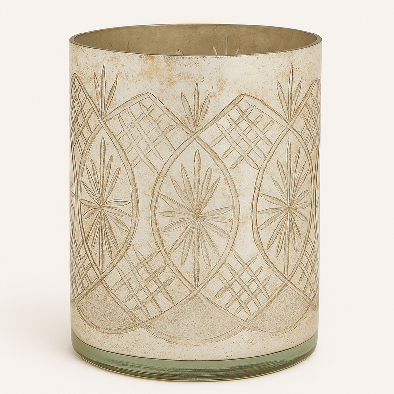 Large mercury glass candleholder for a festive table setting.