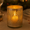 Large mercury glass candleholder for a festive table setting.