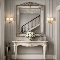 Above a console in a traditional hallway, reflecting sweeping staircase and chandelier.