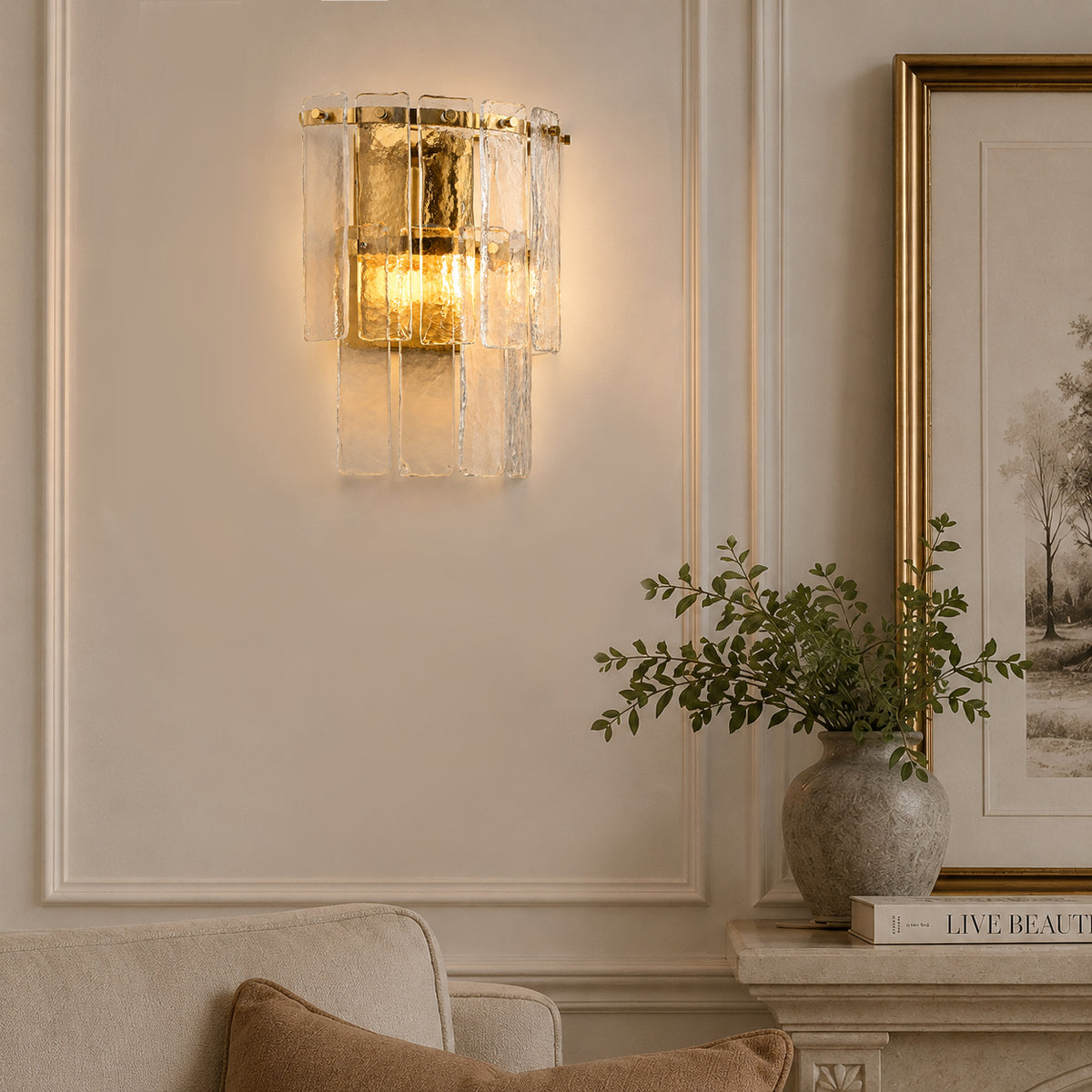 Wall light with textured glass panels and a warm gilt metal frame in a living room