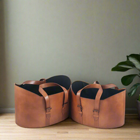 Pair of leather storage baskets on a wooden floor.