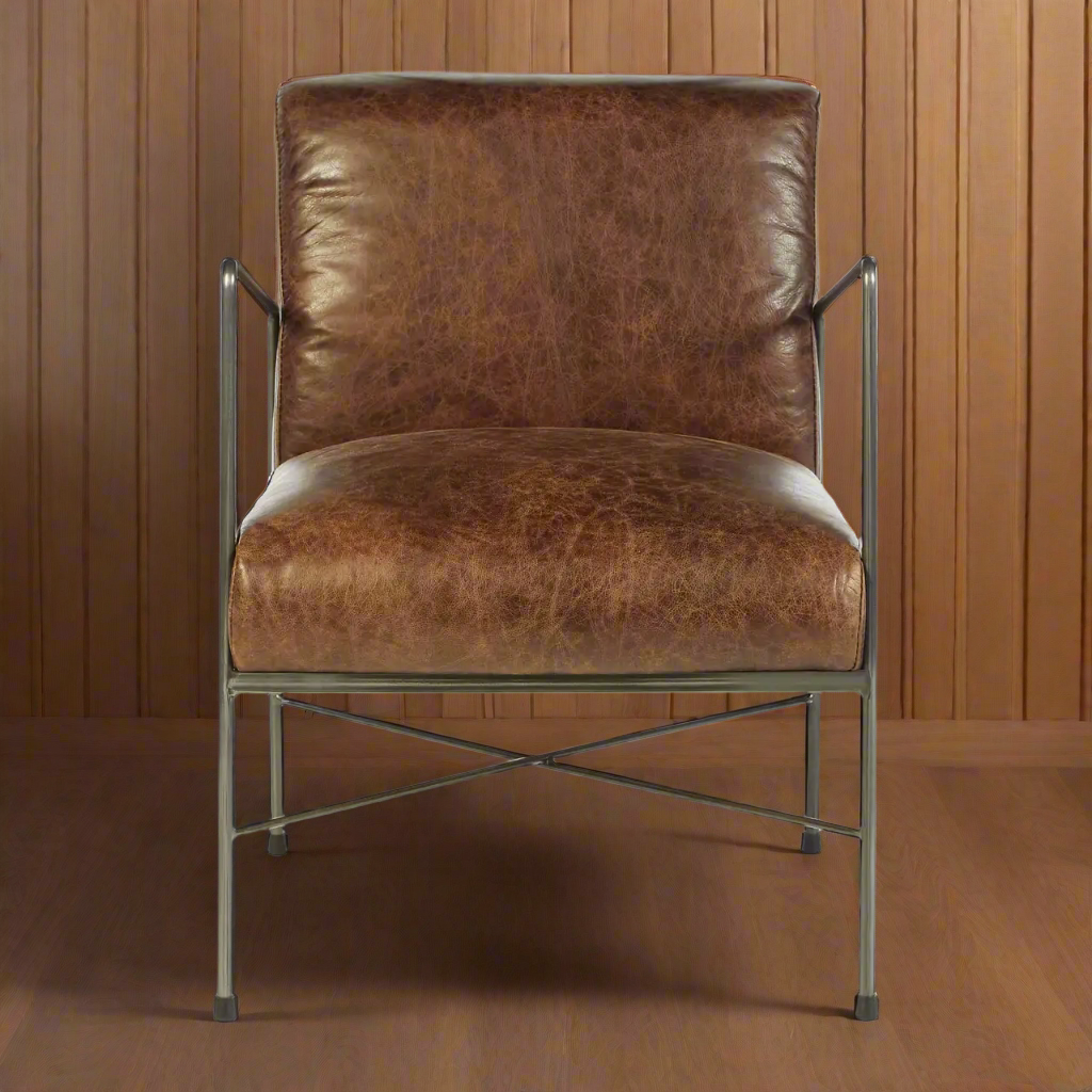 Such a simple, stylish deep cushioned leather chair, really slim profile adds to the sleek lines. a great occasional chair in a sumptuous leather on a metal frame. Would look perfect in an inustrial space, as an extra chair in a living room or study.