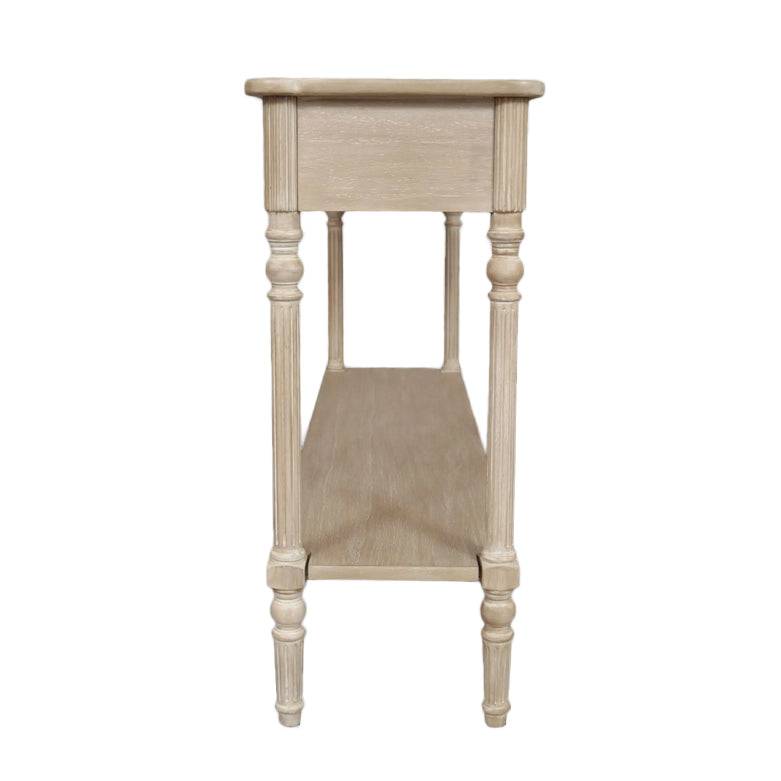 A classic long console table with two useful draws and lower shelf for storage. A hardwood piece made from Mindi wood, finished in an ash lime wash veneer finish, a side perspective.