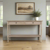 A classic long console table with two useful draws and lower shelf for storage. A hardwood piece made from Mindi wood, finished in an ash lime wash veneer finish in a country cottage setting.