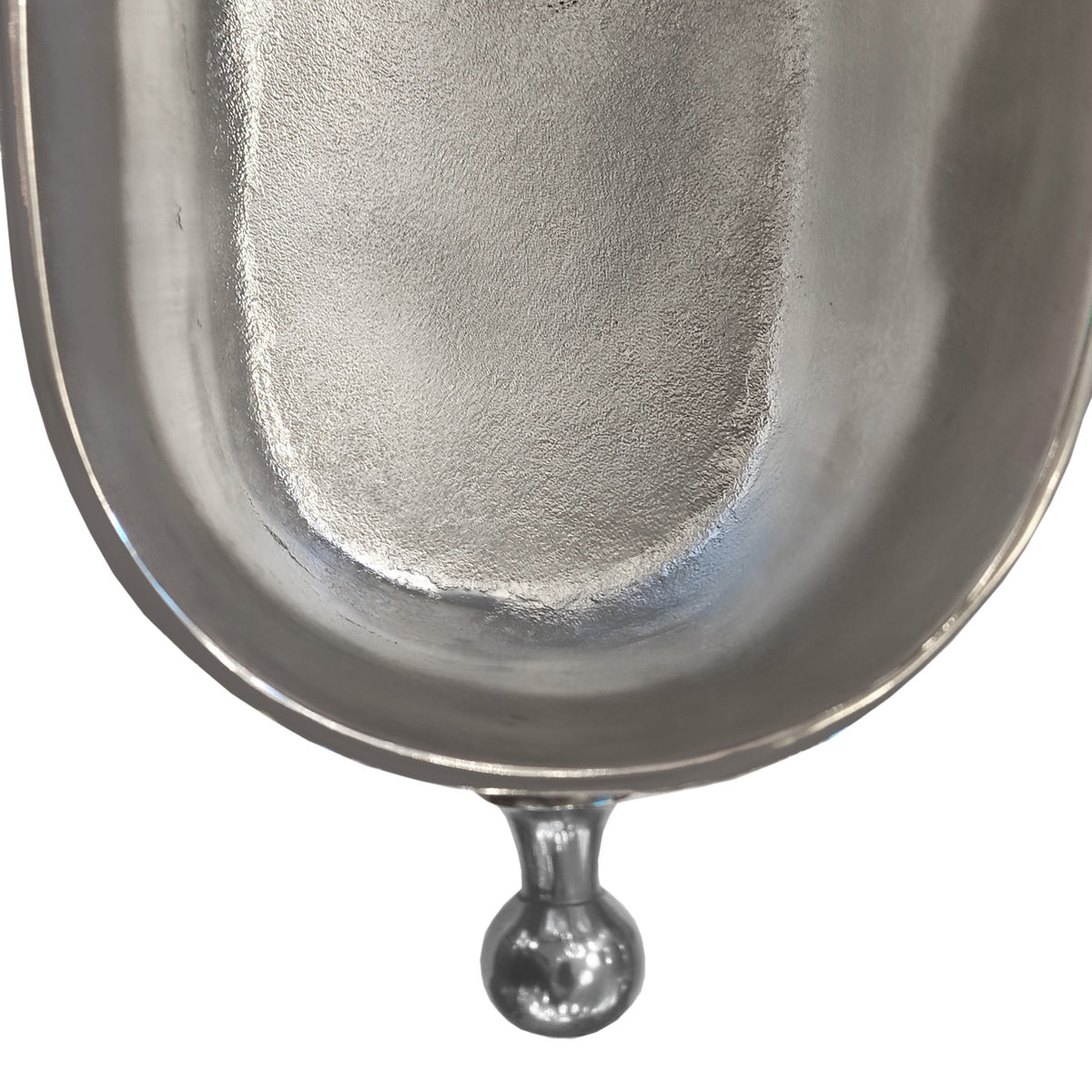 Close-up of a polished metallic silver object, showing a curved reflective surface  isolated on a white background.