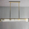 Long glass tubular, linear light, set on two gilt bars and a gilt coloured roof plate. The ends of the long bar are enclosed by two round gilt discs. Great Island light.
