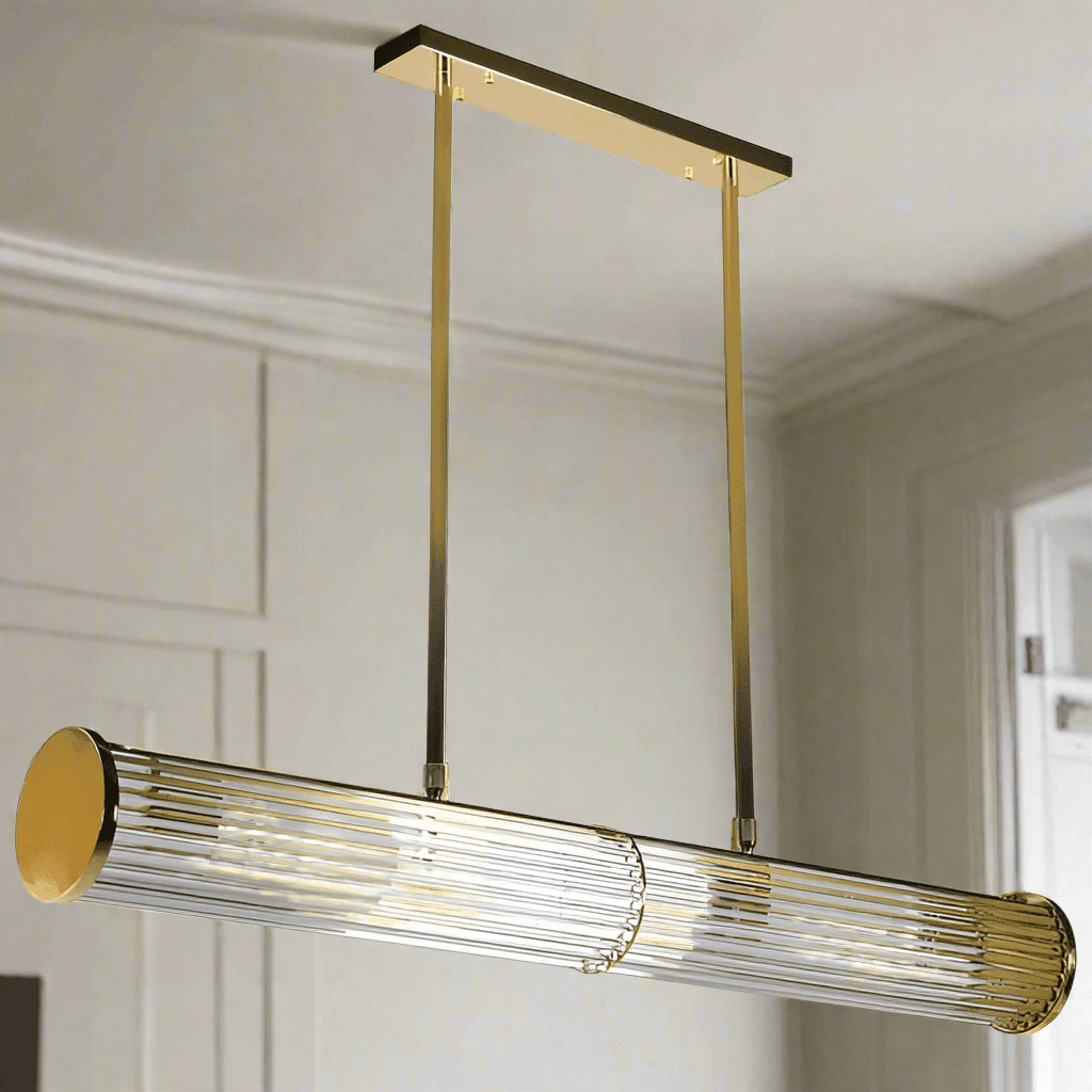 Long glass tubular, linear light, set on two gilt bars and a gilt coloured roof plate. The ends of the long bar are enclosed by two round gilt discs. Great Island light.