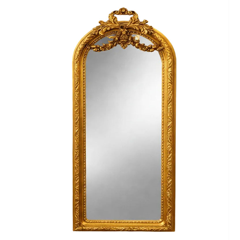 Ornate gilt swag mirror with arched top and decorative frame