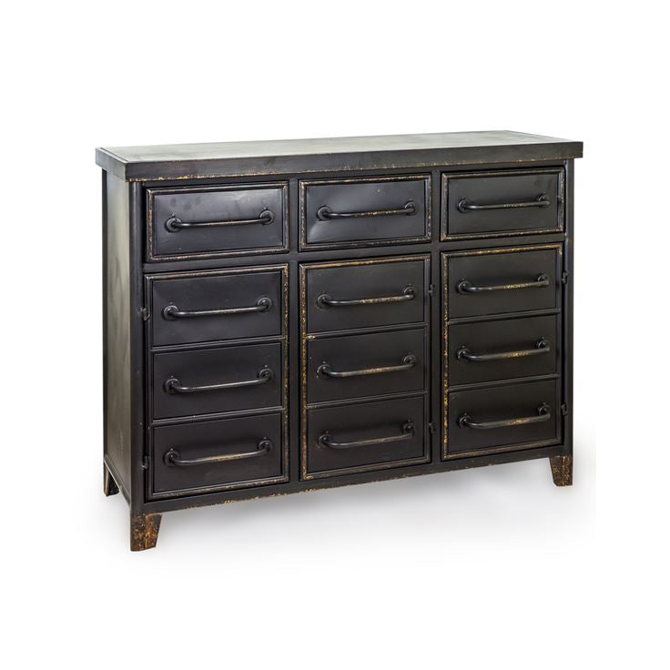 A black industrial-style metal chest of drawers featuring multiple storage compartments, aged bronze-effect trim and tubular metal handles, designed with a vintage factory aesthetic suitable for contemporary and loft-style interiors.