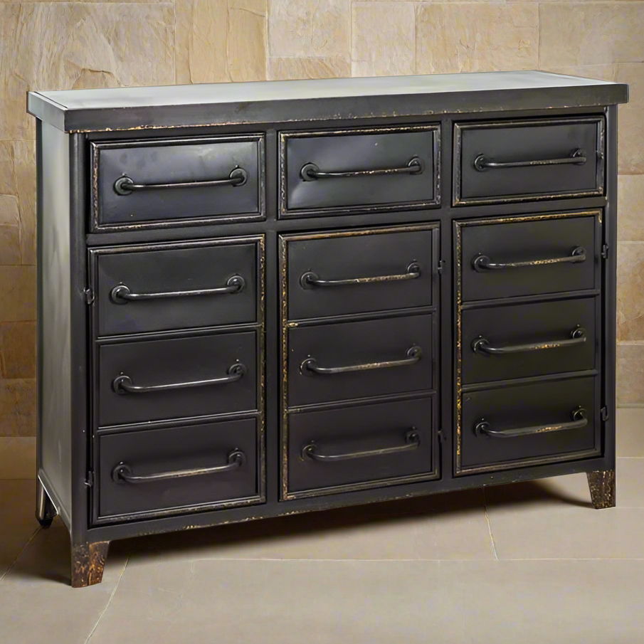 Industrial black metal chest of drawers with multiple drawers, distressed bronze detailing and vintage factory-inspired styling. Close up of distressed finish on chest.