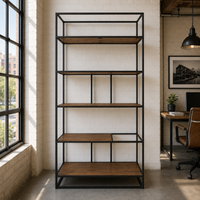 Tall black metal shelf with wooden shelves in a room with large windows and a desk.