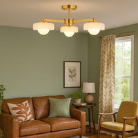 Mid-century style three globe ceiling light with brushed gilt metal frame and opal glass shades by Decorexi