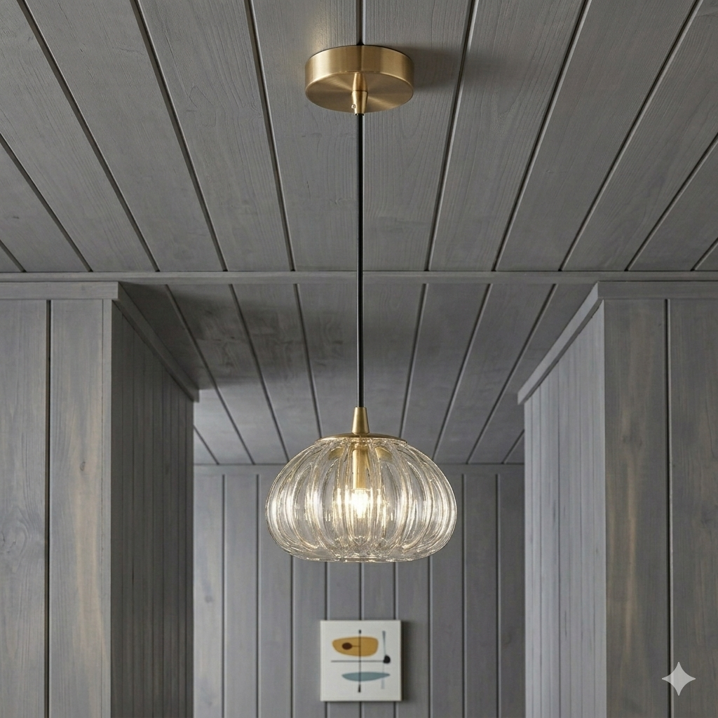 Modern pendant light with ribbed glass shade hanging from a wooden ceiling.