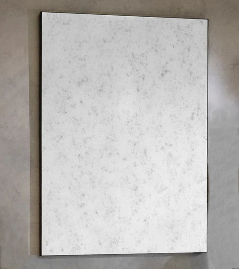 Aged glass rectangular mirror on a grey background