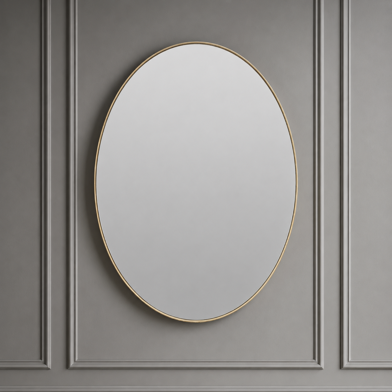 Round mirror with a gold frame on a gray paneled wall