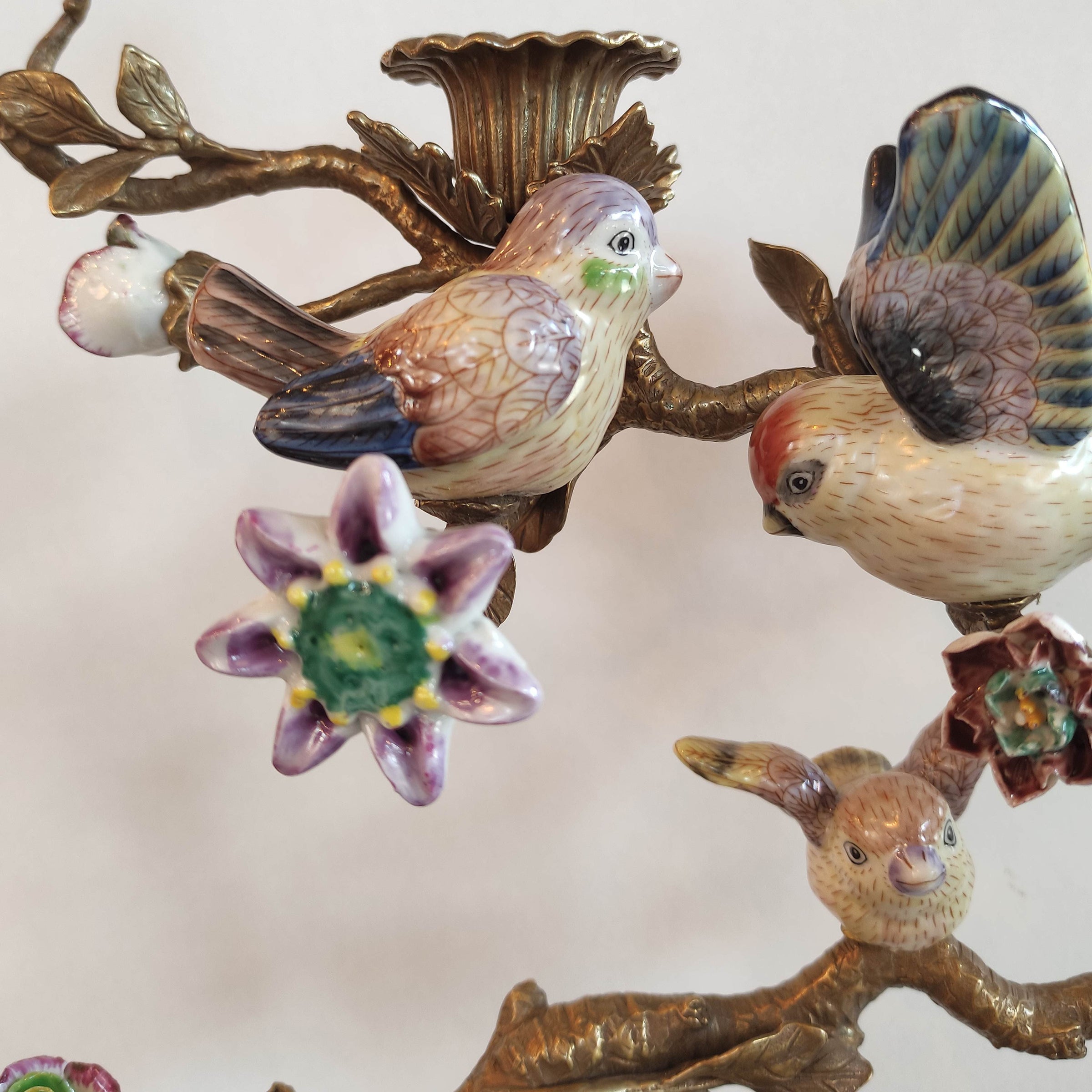 Decorative wall art with birds and flowers on a beige background