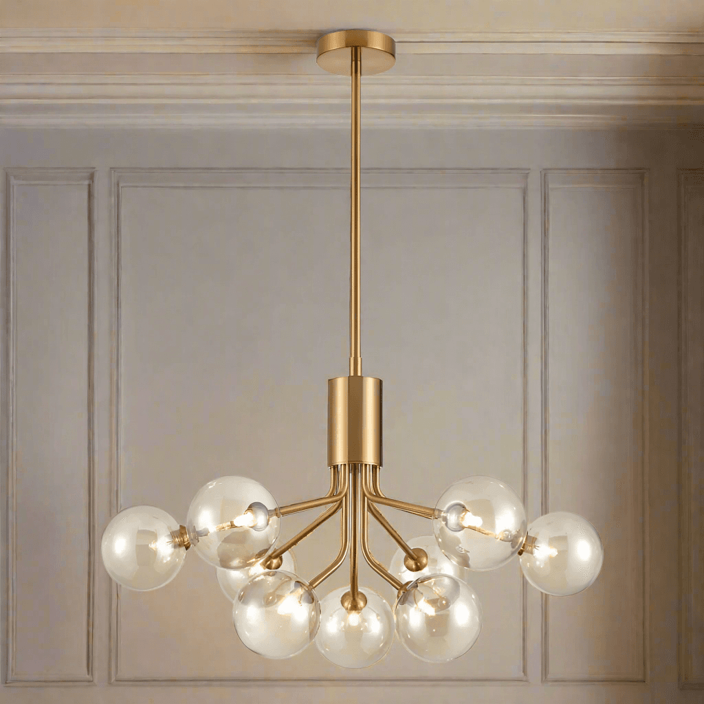 Tinted glass nine globe chandelier with brushed brass arms and adjustable rod