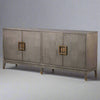 A sleek, contemporary long sideboard in a pale grey finish.&nbsp; This sideboard has four doors and has a particular stylish set of handles to the door in a dark gilt finish.&nbsp; There is a pattern of squares in the wooden surface of this piece. The sidebaord has four doors and two shelves behind each door, which provides ample storage.&nbsp; Perfect contemporary piece for your dining or living room, the colour of this sideboard would work well in a contemporary setting.