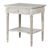 Off white classic one drawer bedside with lower shelf and reeded legs. This is a timeless table crafted individually to the highest quality and the perfect off white, pale grey washed colour that will suit so many interiors. Functional with a drawer and lower curved shelf.