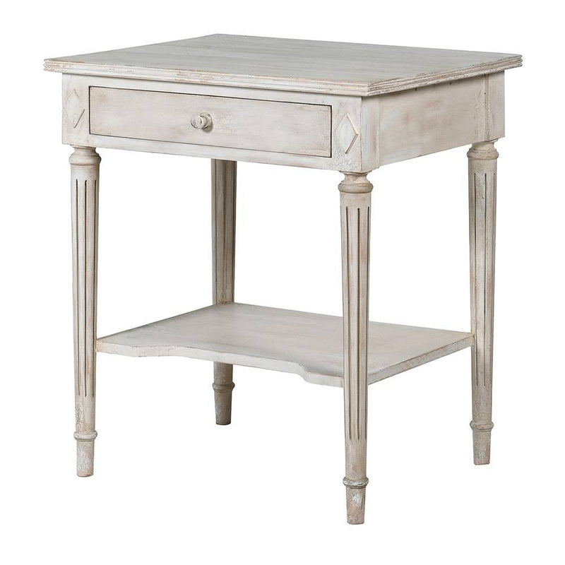 Off white classic one drawer bedside with lower shelf and reeded legs. This is a timeless table crafted individually to the highest quality and the perfect off white, pale grey washed colour that will suit so many interiors. Functional with a drawer and lower curved shelf.