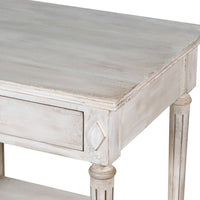 Off white classic one drawer bedside with lower shelf and reeded legs. This is a timeless table crafted individually to the highest quality and the perfect off white, pale grey washed colour that will suit so many interiors. Functional with a drawer and lower curved shelf.