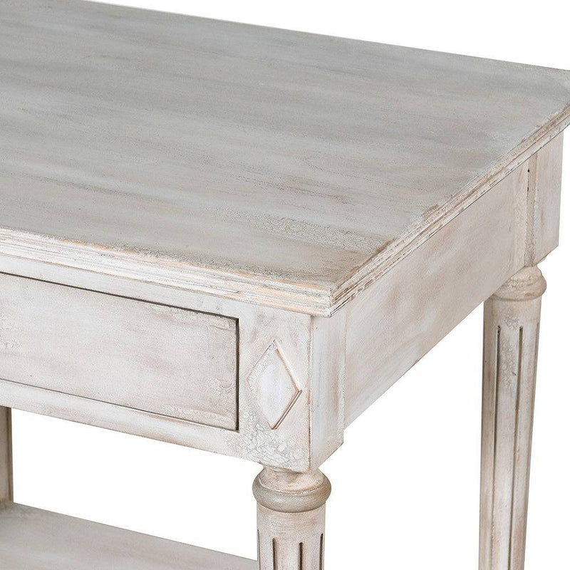 Off white classic one drawer bedside with lower shelf and reeded legs. This is a timeless table crafted individually to the highest quality and the perfect off white, pale grey washed colour that will suit so many interiors. Functional with a drawer and lower curved shelf.