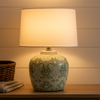&nbsp;Featuring a classic floral design in soft green and white, this lamp effortlessly blends vintage elegance with modern farmhouse style. The glossy ceramic finish adds a touch of luxury, while the neutral tones make it versatile enough for any room — from bedside tables and living room consoles to entryway décor.

This handcrafted ceramic lamp base pairs beautifully with a wide variety of lampshades, allowing you to customize it to your personal style. Whether you’re aiming for&nbsp;cottage chic, boho e