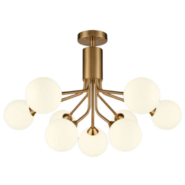 Opaque globe 9 ball chandelier with brushed brass arms and opal glass shades hanging from an adjustable rod