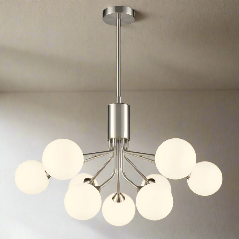 Nine light opaque glass globe ceiling light in satin nickel finish with mid century design