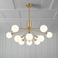 Twelve light opaque glass globe ceiling pendant in brushed brass finish