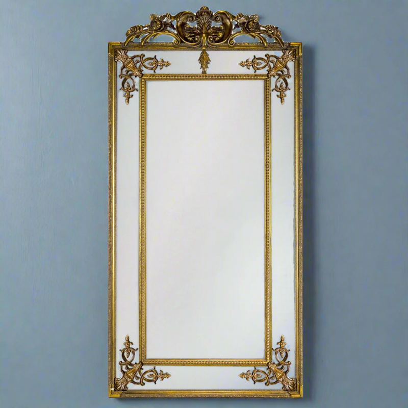Stunning panelled gold mirror with decorative crown. The bevelled edges on the panels in this magnificent mirror spreads light in any room.&nbsp;&nbsp; This is the slimmer version or our massive French mirror, tall, elegant and perfect in your bedroom or at the end of a corridor to add a light and space.
