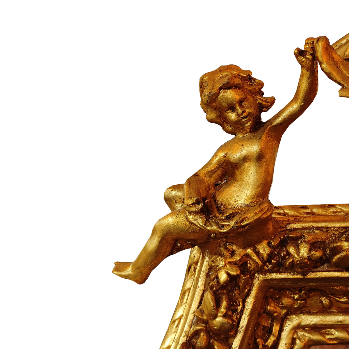 Close up of cherub decoration on the large cherub ornate mirror.