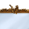 Ornate rectangular gold overmantle mirror with carved floral crest and gilt frame. Close Up of Crest.