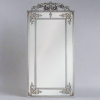 Large ornate silver panelled wall mirror with bevelled glass panels and decorative silver frame