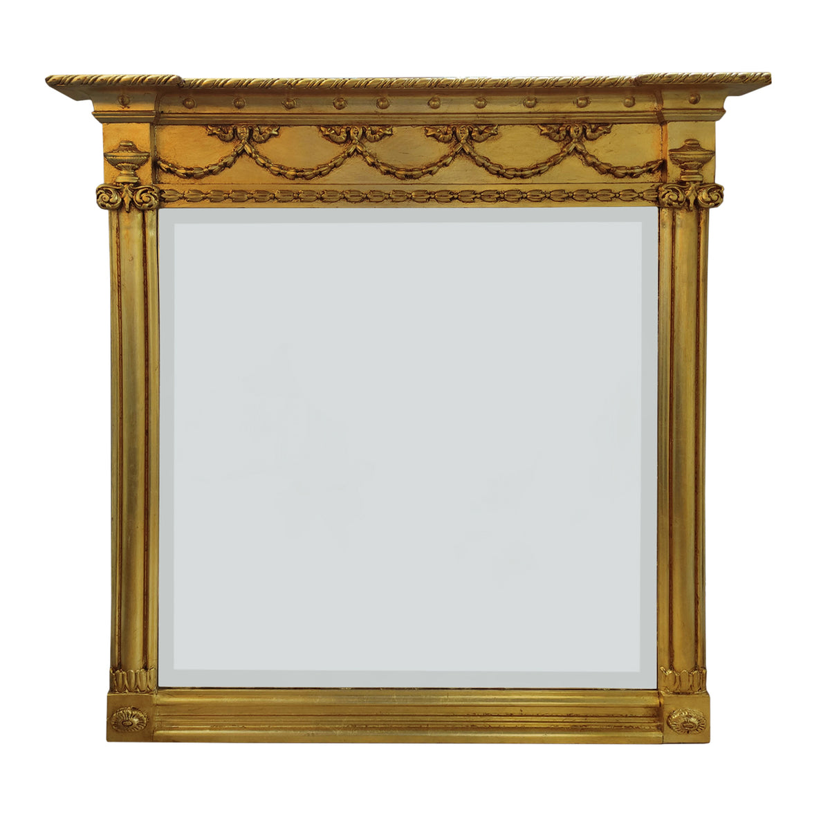 Our exquisite Ornate Giltwood Overmantle mirror is a breathtaking reproduction inspired by Victorian and Edwardian design. Measuring 120x120cm, this pale gilt-finished masterpiece adds a touch of grandeur to any space, whether perched above a marble fireplace in a city townhouse or gracing the walls of a countryside retreat.