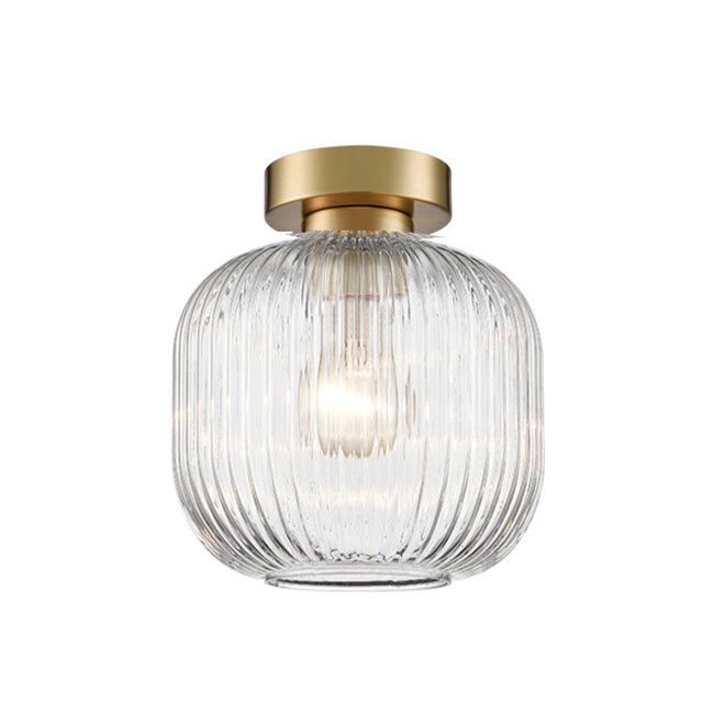 A modern semi-flush mount ceiling light featuring a ribbed clear glass shade and a brushed brass  ceiling rose