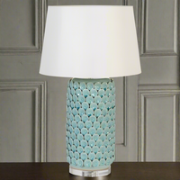 Celadon coloured ceramic table lamp. Exquisite detail on this beautifully coloured lampbase and the large neutral shade add to the 'wow' factor this will give any interior.