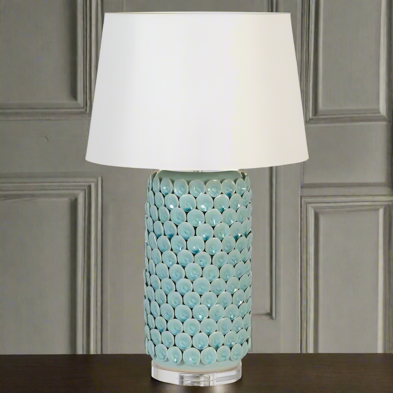 Celadon coloured ceramic table lamp. Exquisite detail on this beautifully coloured lampbase and the large neutral shade add to the 'wow' factor this will give any interior.