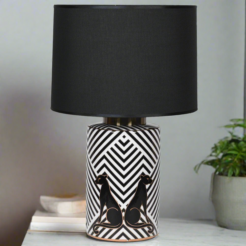 This beautifully black and white pattern ceramic lamp with black panthers would suit a cool contemporary interior.&nbsp; These lamps come with a large black fabric shade to complete this sophisticated look.