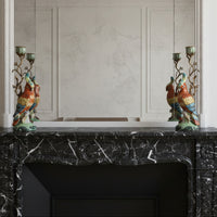 Pair of colourful bronze and porcelain on black marble mantlepiece.