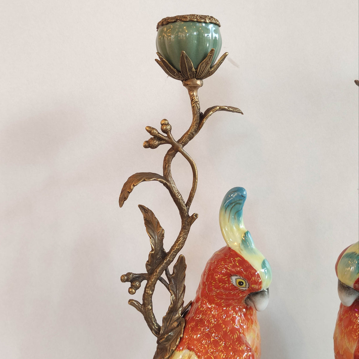 Colorful parrot ceramic candlestick with bronze branch detail