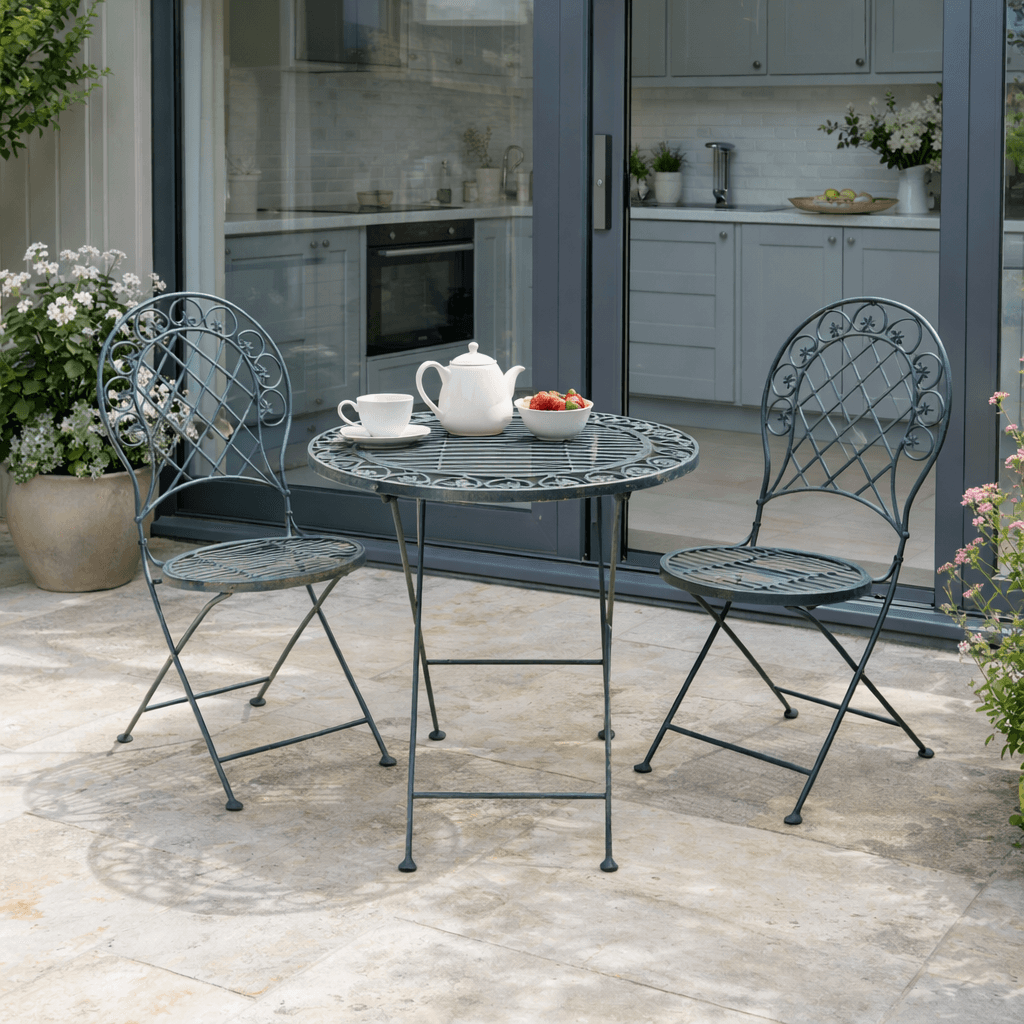 This three-piece grey, folding patio set combines classic design with practical outdoor living. Featuring a round metal table and two matching folding chairs,
