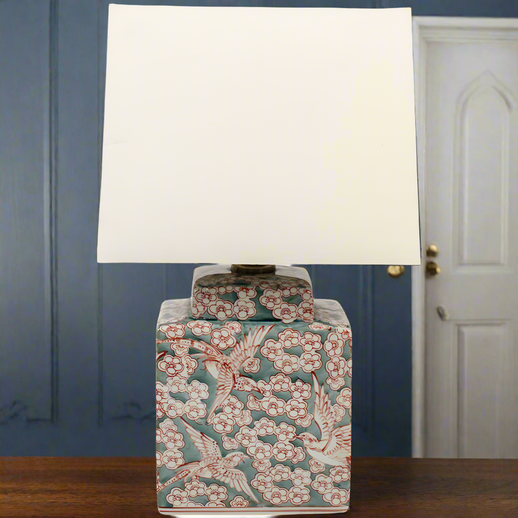 A delicate fauna and flora sage green and red lamp base with a white linen shade.&nbsp; Small enough to use as bedside lamps or as a small side lamp where your space will be transformed into a cosy area.&nbsp; The white linen shades diffuses ample light and you can choose from our recommended bulbs below to get the colour temperature right for your room. We have a wide range of ceramic lamps on our site for your to choose from, all colours and sizes. 