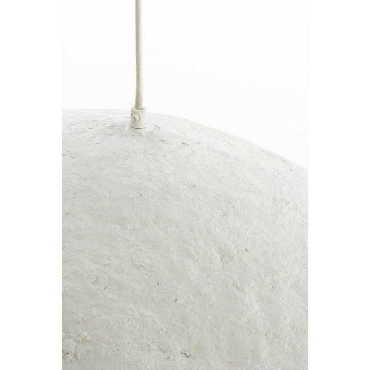 Detail of the textured plaster exterior of wave pendant light