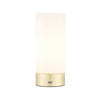 A cylindrical portable table lamp with a milk glass in a sleek brushed brass metal base. It has an USB port to charge any devices and a three touch dimmer settings.