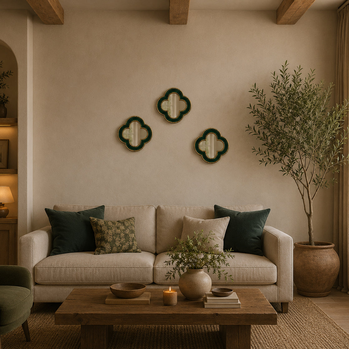 Small quatrefoil mirror with a luxurious gold beaded border in a gallery wall