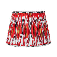 Red pleated cotton lampshade with bold Ikat pattern in red, white and gold tones.