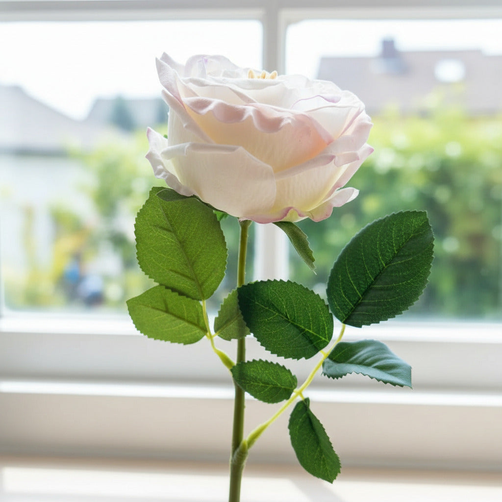 Artificial flower on a wooden surface