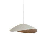 Side view of sculptural plaster wave pendant light