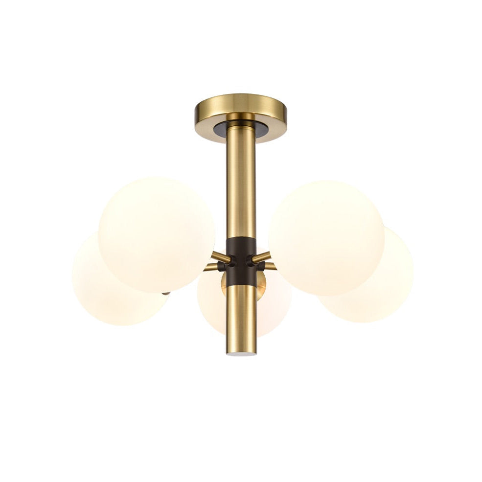 Semi Flush ceiling pendant with 5 opaque globe lights set on a brushed gold frame with central black accents.